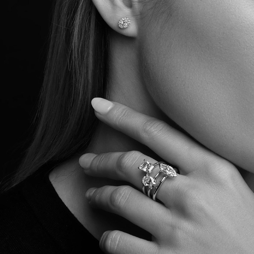 Diamond earring and ring stack, worn