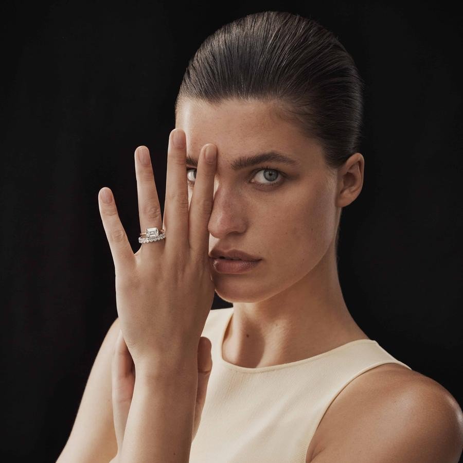 A custom TenSevenSeven engagement ring, worn